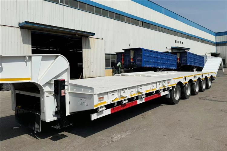TITAN 5 Axle 100 Ton Low Bed Trailer for Sale In Tanzania - Félpótkocsi mélybölcsős: 4 kép. TITAN 5 Axle 100 Ton Low Bed Trailer for Sale In Tanzania - Félpótkocsi mélybölcsős: 4 kép.