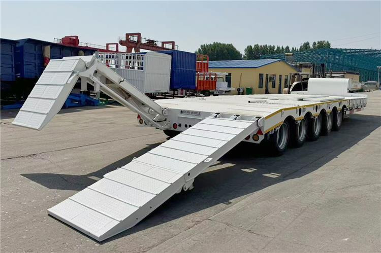 TITAN 5 Axle 100 Ton Low Bed Trailer for Sale In Tanzania - Félpótkocsi mélybölcsős: 2 kép. TITAN 5 Axle 100 Ton Low Bed Trailer for Sale In Tanzania - Félpótkocsi mélybölcsős: 2 kép.