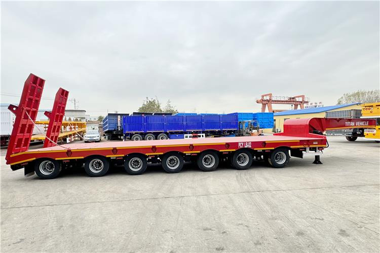 TITAN 7 Axle 120 Ton Lowbed Trailer for Sale In Saudi Arabia - Félpótkocsi mélybölcsős: 4 kép. TITAN 7 Axle 120 Ton Lowbed Trailer for Sale In Saudi Arabia - Félpótkocsi mélybölcsős: 4 kép.