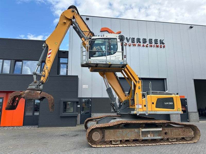 Liebherr LH 30 C - Hulladék kotró: 1 kép. Liebherr LH 30 C - Hulladék kotró: 1 kép.