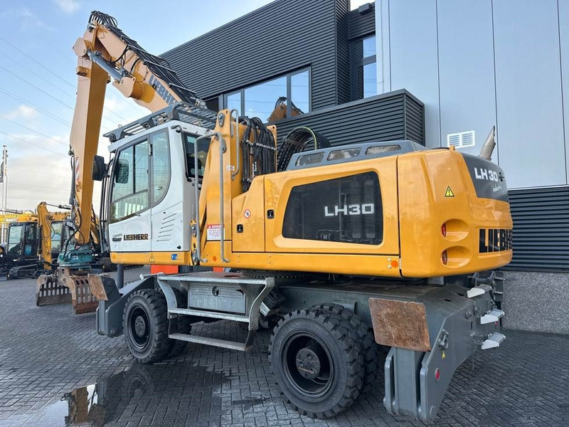 Liebherr LH 30 M - Hulladék kotró: 3 kép. Liebherr LH 30 M - Hulladék kotró: 3 kép.