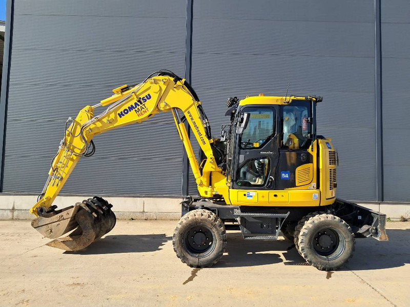 Komatsu PW98MR-11E0 - Gumikerekes kotró: 2 kép. Komatsu PW98MR-11E0 - Gumikerekes kotró: 2 kép.