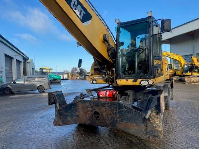 Hulladék kotró a következők szállításához hulladék Cat M 318 D MH (12005607): 11 kép. Hulladék kotró a következők szállításához hulladék Cat M 318 D MH (12005607): 11 kép.