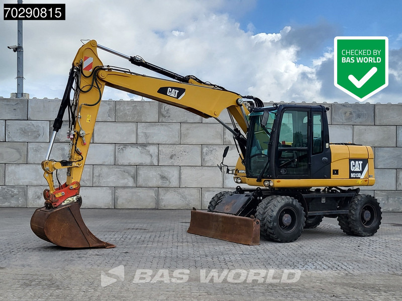 Caterpillar M313 D - Gumikerekes kotró: 1 kép. Caterpillar M313 D - Gumikerekes kotró: 1 kép.