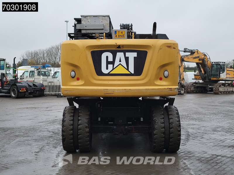 Caterpillar M318 F - Gumikerekes kotró: 3 kép. Caterpillar M318 F - Gumikerekes kotró: 3 kép.