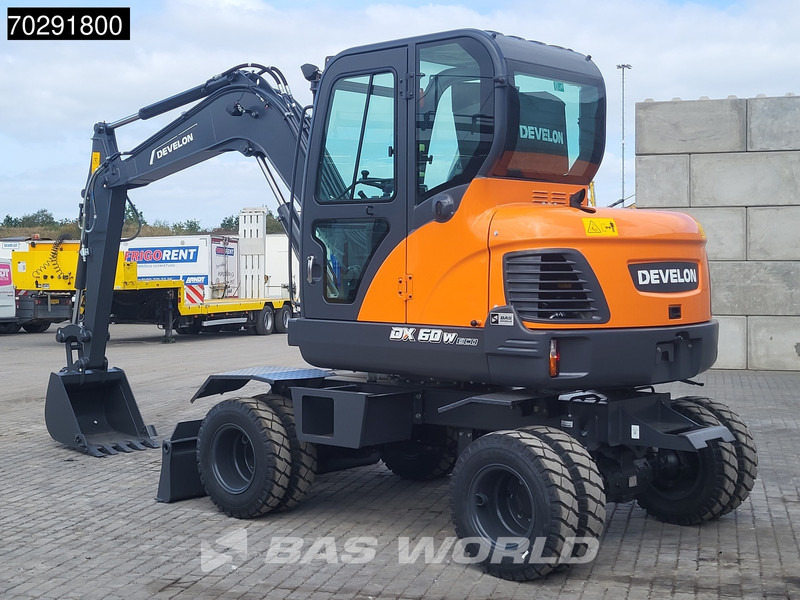 Develon DX60 WN ECO-1 A/C - Gumikerekes kotró: 3 kép. Develon DX60 WN ECO-1 A/C - Gumikerekes kotró: 3 kép.