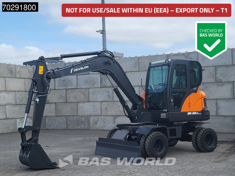 Develon DX60 WN ECO-1 A/C - Gumikerekes kotró: 1 kép. Develon DX60 WN ECO-1 A/C - Gumikerekes kotró: 1 kép.