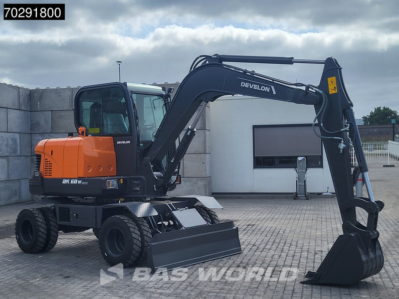 Develon DX60 WN ECO-1 A/C - Gumikerekes kotró: 5 kép. Develon DX60 WN ECO-1 A/C - Gumikerekes kotró: 5 kép.