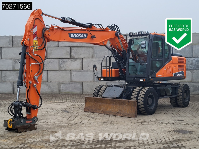 Doosan DX140 W-5 OIL QUICK - GERMAN - Gumikerekes kotró: 1 kép. Doosan DX140 W-5 OIL QUICK - GERMAN - Gumikerekes kotró: 1 kép.