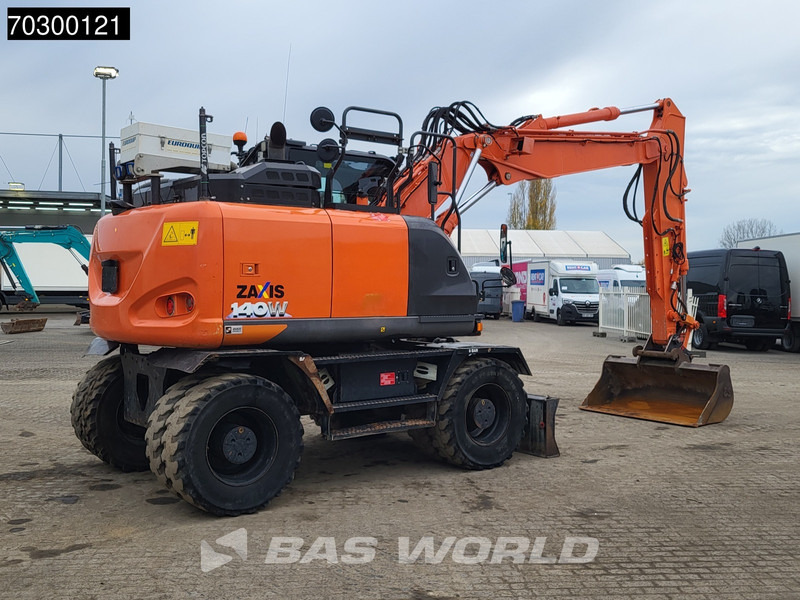 Hitachi ZX140W -6 - Gumikerekes kotró: 5 kép. Hitachi ZX140W -6 - Gumikerekes kotró: 5 kép.