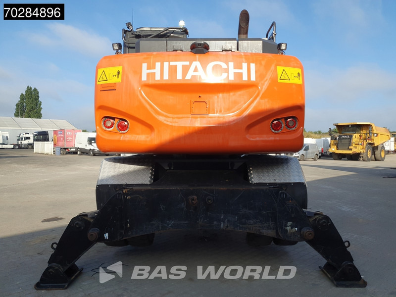 Hitachi ZX140W -6 OUTRIGGERS + BLADE - Gumikerekes kotró: 3 kép. Hitachi ZX140W -6 OUTRIGGERS + BLADE - Gumikerekes kotró: 3 kép.