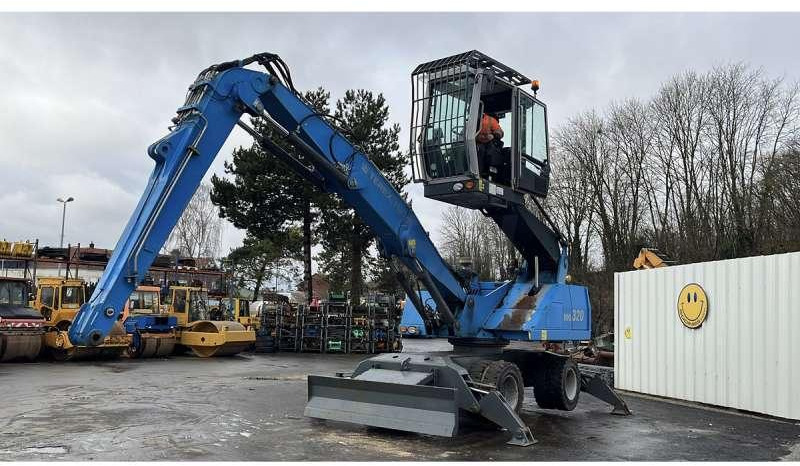 Fuchs MHL320 - Hulladék kotró: 1 kép. Fuchs MHL320 - Hulladék kotró: 1 kép.