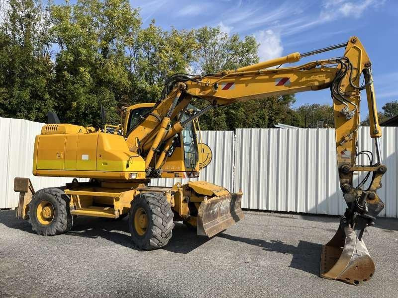 Volvo EW140D - Gumikerekes kotró: 1 kép. Volvo EW140D - Gumikerekes kotró: 1 kép.