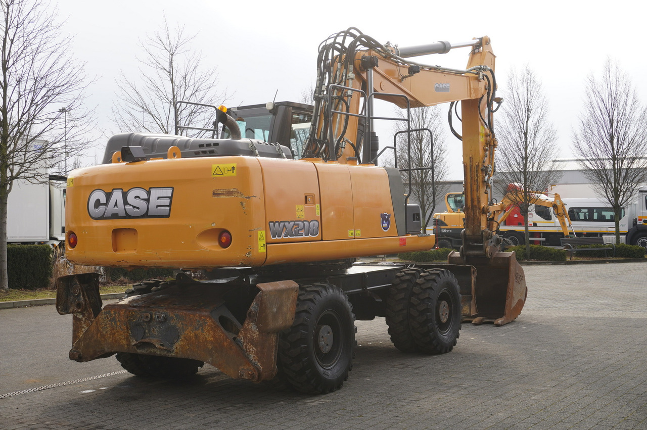 CASE WX218 / 23t wheeled excavator / 3 times folding arm - Gumikerekes kotró: 5 kép. CASE WX218 / 23t wheeled excavator / 3 times folding arm - Gumikerekes kotró: 5 kép.