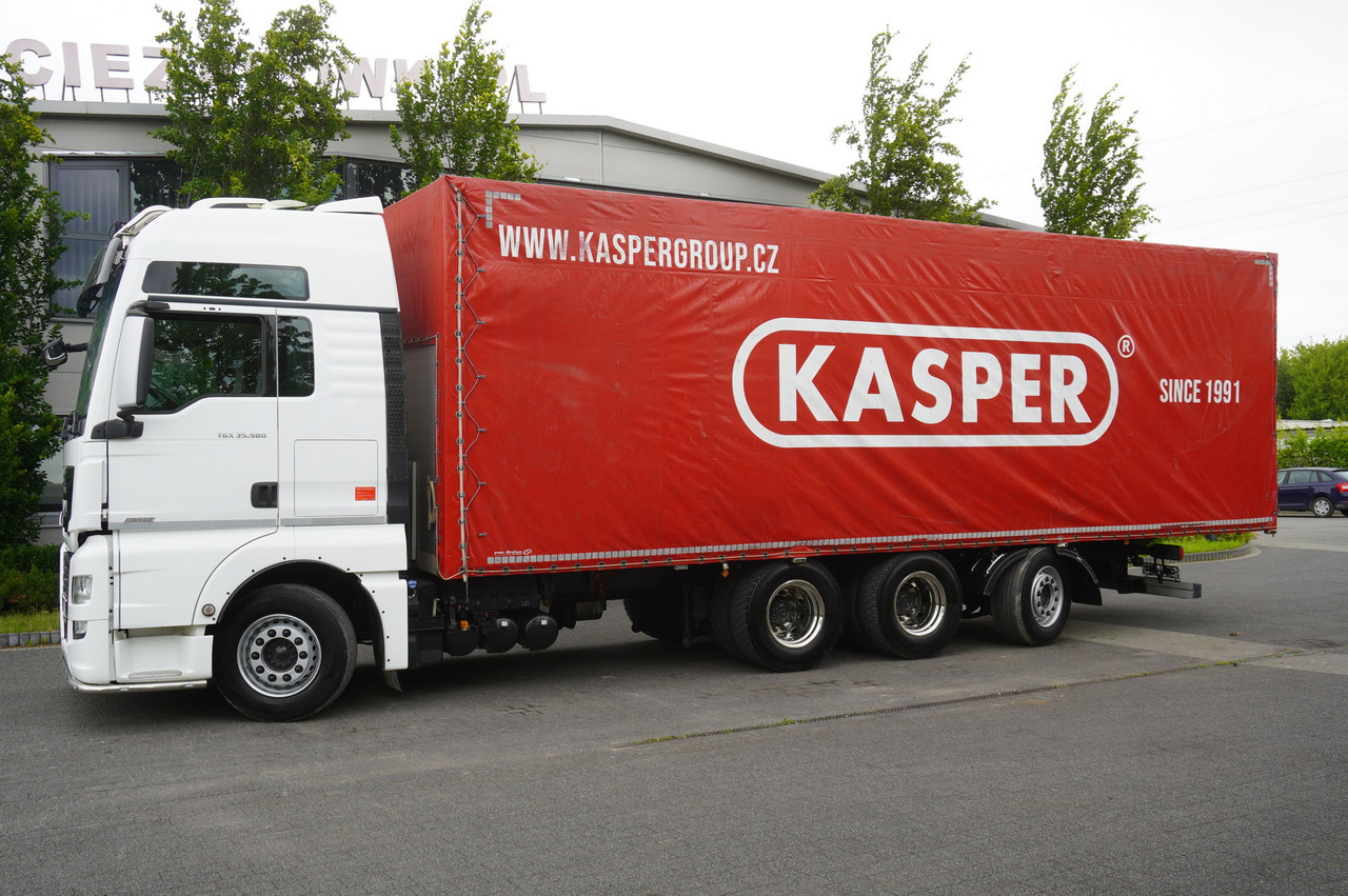 MAN MAN TGX 35.580 E6 8x4 /4 / 23 EPAL tarp superstructure / 4th axle steered - Ponyvás teherautó: 2 kép. MAN MAN TGX 35.580 E6 8x4 /4 / 23 EPAL tarp superstructure / 4th axle steered - Ponyvás teherautó: 2 kép.