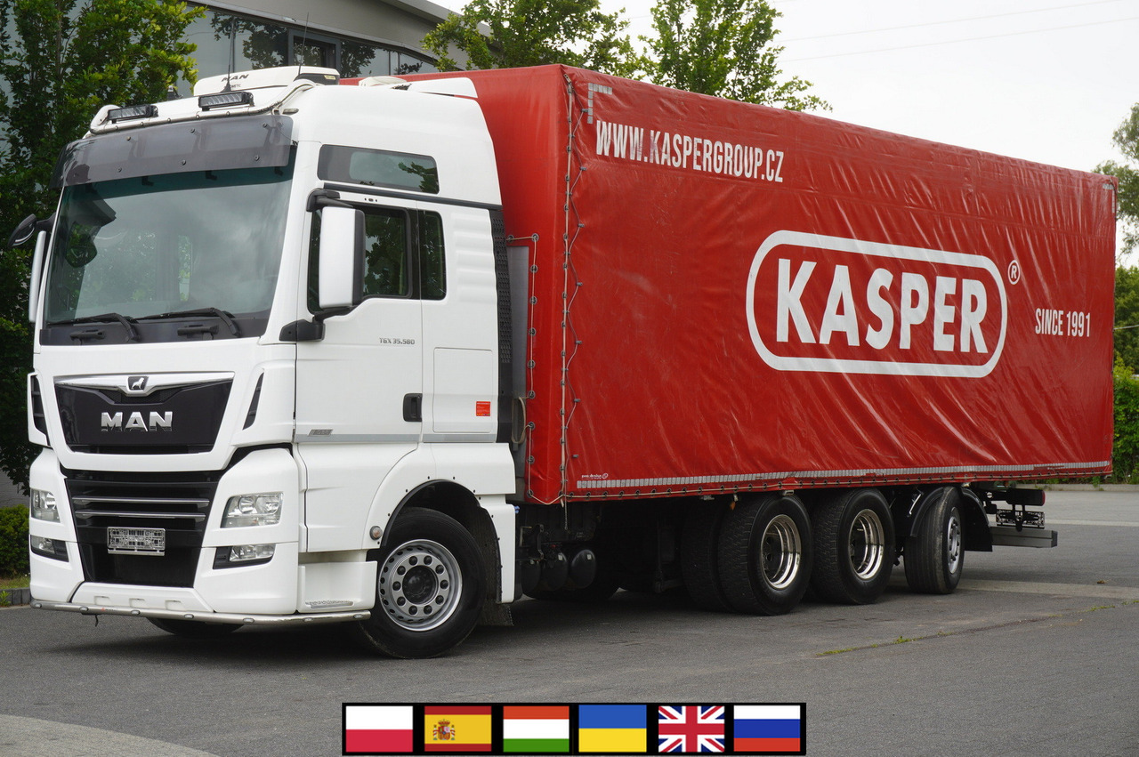 MAN MAN TGX 35.580 E6 8x4 /4 / 23 EPAL tarp superstructure / 4th axle steered - Ponyvás teherautó: 1 kép. MAN MAN TGX 35.580 E6 8x4 /4 / 23 EPAL tarp superstructure / 4th axle steered - Ponyvás teherautó: 1 kép.