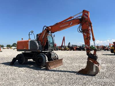 HITACHI ZX140W-3 - Gumikerekes kotró: 4 kép. HITACHI ZX140W-3 - Gumikerekes kotró: 4 kép.