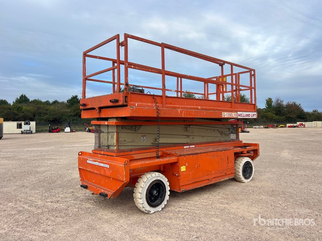 2002 Holland Lift Q135EL18 Electric Nacelle Ciseaux Electrique Scissor Lift - Ollós emelő: 2 kép. 2002 Holland Lift Q135EL18 Electric Nacelle Ciseaux Electrique Scissor Lift - Ollós emelő: 2 kép.