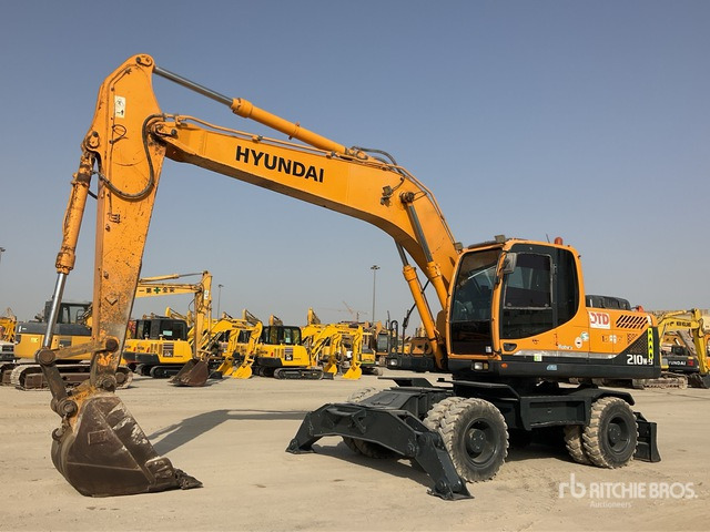 Hyundai Robex 210W-9S - Gumikerekes kotró: 1 kép. Hyundai Robex 210W-9S - Gumikerekes kotró: 1 kép.
