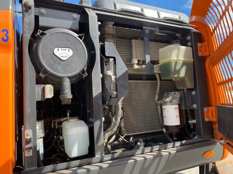 Doosan DX160W - Gumikerekes kotró: 4 kép. Doosan DX160W - Gumikerekes kotró: 4 kép.