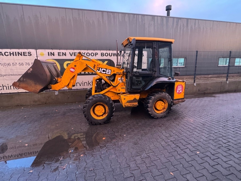 JCB 2 CX Airmaster - Gumikerekes homlokrakodó: 5 kép. JCB 2 CX Airmaster - Gumikerekes homlokrakodó: 5 kép.