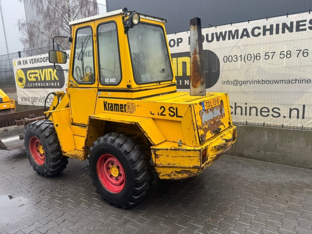 Kramer-allrad 312 SL - Gumikerekes homlokrakodó: 2 kép. Kramer-allrad 312 SL - Gumikerekes homlokrakodó: 2 kép.