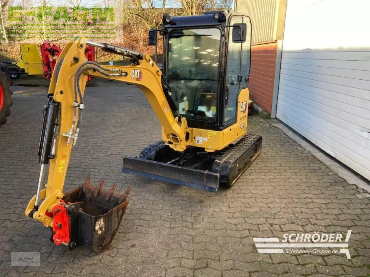 Caterpillar 302 cr inkl. tieflöffel - Minikotró: 4 kép. Caterpillar 302 cr inkl. tieflöffel - Minikotró: 4 kép.