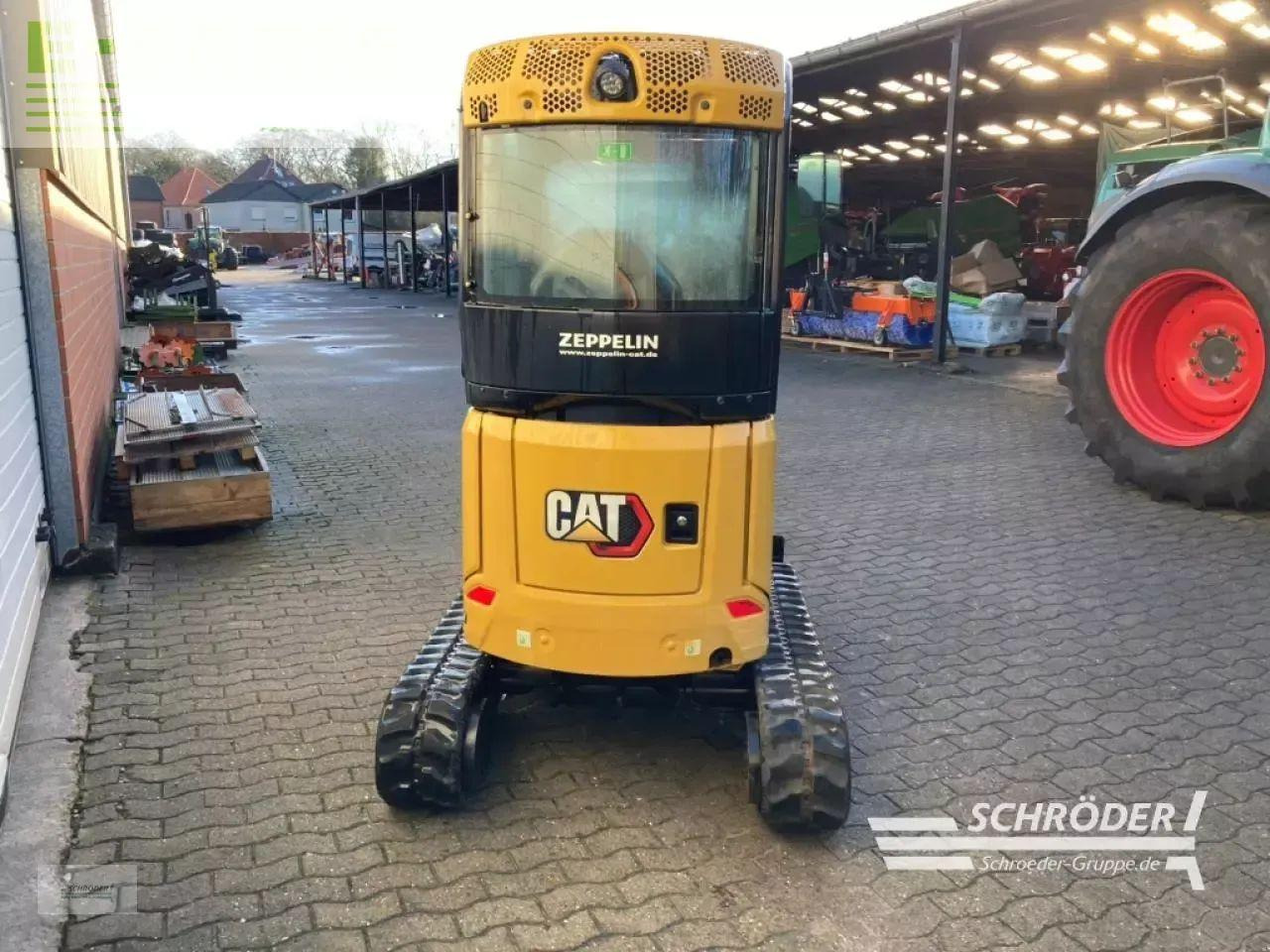 Caterpillar 302 cr inkl. tieflöffel - Minikotró: 3 kép. Caterpillar 302 cr inkl. tieflöffel - Minikotró: 3 kép.