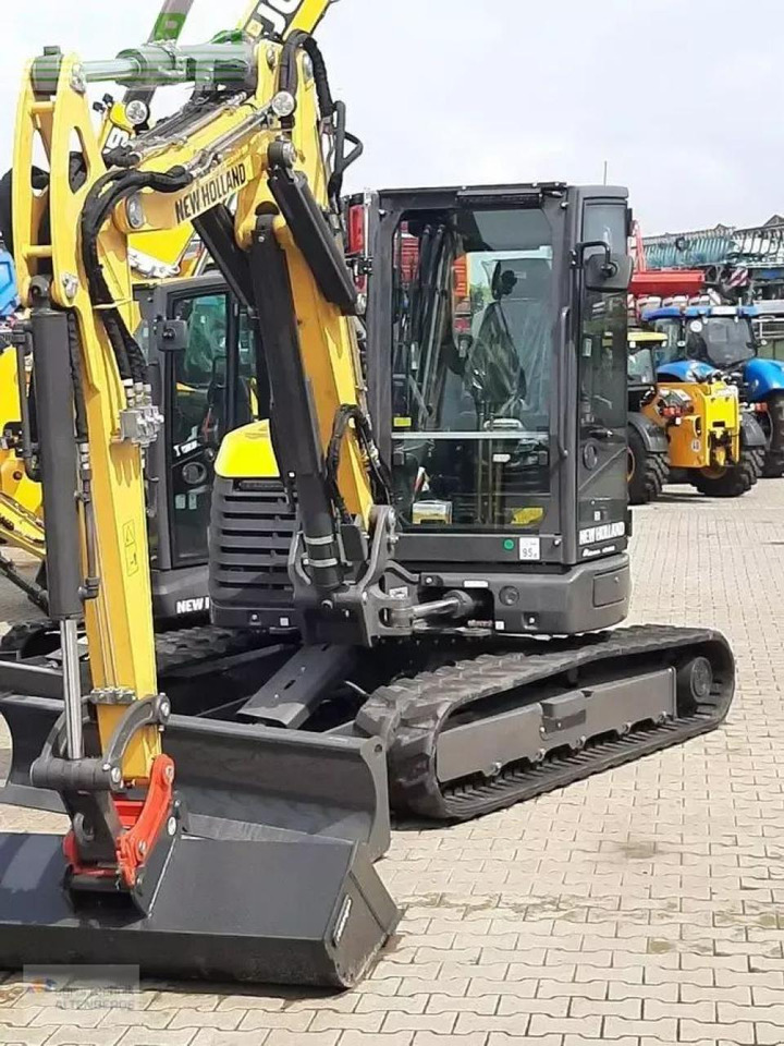 New Holland e65d - Minikotró: 2 kép. New Holland e65d - Minikotró: 2 kép.