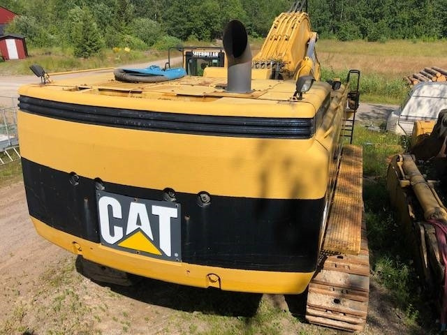 CAT 385 B - Lánctalpas kotró: 4 kép. CAT 385 B - Lánctalpas kotró: 4 kép.