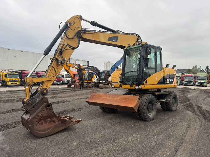 Caterpillar M313D 7212 HOURS - Gumikerekes kotró: 4 kép. Caterpillar M313D 7212 HOURS - Gumikerekes kotró: 4 kép.