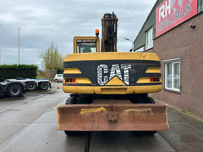 Caterpillar M315 +ROTO CE - Gumikerekes kotró: 5 kép. Caterpillar M315 +ROTO CE - Gumikerekes kotró: 5 kép.