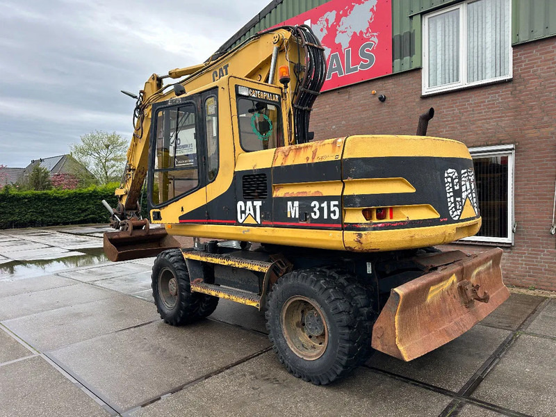 Caterpillar M315 +ROTO CE - Gumikerekes kotró: 4 kép. Caterpillar M315 +ROTO CE - Gumikerekes kotró: 4 kép.