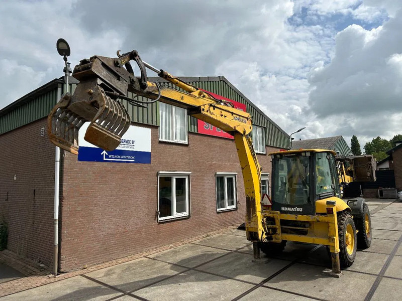 Komatsu WB97S-5E0 - Kotrórakodó: 5 kép. Komatsu WB97S-5E0 - Kotrórakodó: 5 kép.