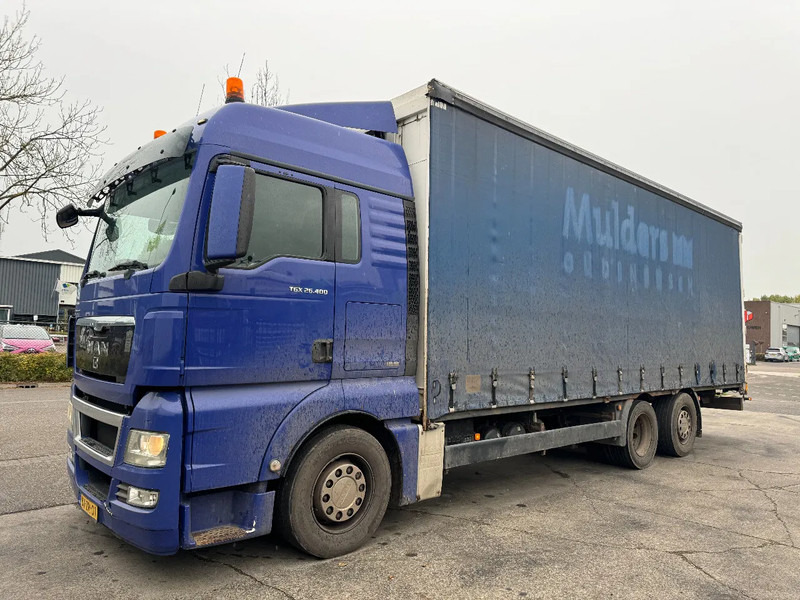 MAN TGX 26.400 6X2 - EURO 4 + LIFT + STEERING AXLE - Ponyvás teherautó: 1 kép. MAN TGX 26.400 6X2 - EURO 4 + LIFT + STEERING AXLE - Ponyvás teherautó: 1 kép.