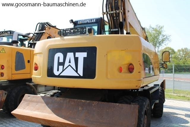 CAT M 315 D - Gumikerekes kotró: 3 kép. CAT M 315 D - Gumikerekes kotró: 3 kép.