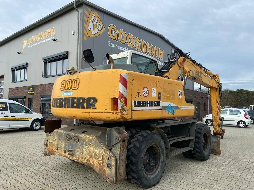 Liebherr A 900 C Litronic - Gumikerekes kotró: 2 kép. Liebherr A 900 C Litronic - Gumikerekes kotró: 2 kép.