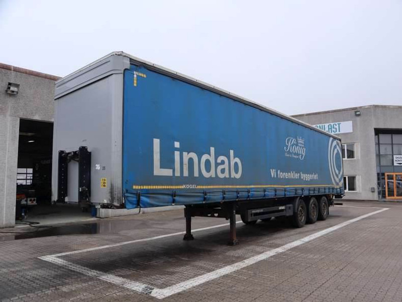 Kögel Curtainsider/Planenauflieger/Gardin - Ponyvás félpótkocsi: 1 kép. Kögel Curtainsider/Planenauflieger/Gardin - Ponyvás félpótkocsi: 1 kép.
