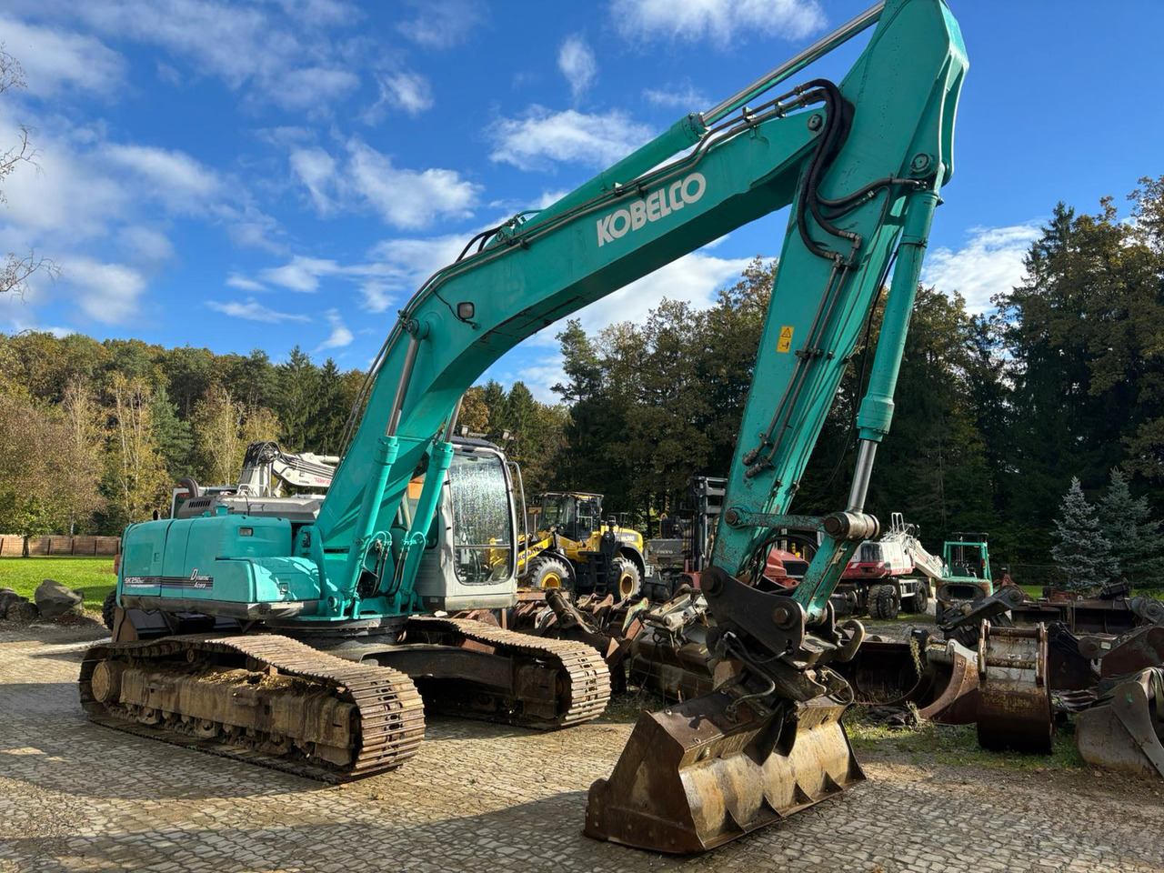 KOBELCO SK 250 NLC-6ES - Lánctalpas kotró: 3 kép. KOBELCO SK 250 NLC-6ES - Lánctalpas kotró: 3 kép.