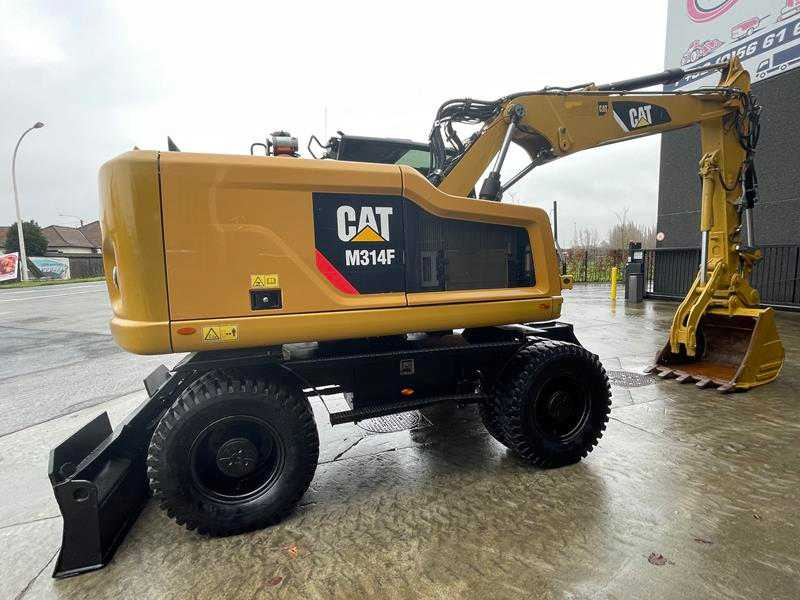 Caterpillar M314F - Gumikerekes kotró: 3 kép. Caterpillar M314F - Gumikerekes kotró: 3 kép.