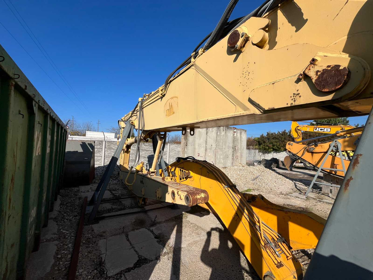 KOMATSU EXCAVATOR BOOM - Kotrógép: 2 kép. KOMATSU EXCAVATOR BOOM - Kotrógép: 2 kép.