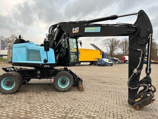 Caterpillar M315F, OilQuick, Hammer- u- Greifersteuerung - Gumikerekes kotró: 2 kép. Caterpillar M315F, OilQuick, Hammer- u- Greifersteuerung - Gumikerekes kotró: 2 kép.