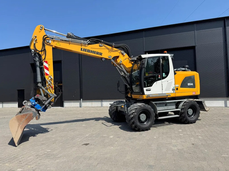 Liebherr A914 2019 7300 uur !! NL MACHINE !! - Gumikerekes kotró: 2 kép. Liebherr A914 2019 7300 uur !! NL MACHINE !! - Gumikerekes kotró: 2 kép.