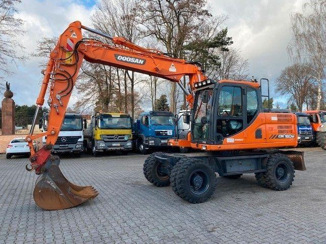 Doosan DX 160 W-3 - Gumikerekes kotró: 1 kép. Doosan DX 160 W-3 - Gumikerekes kotró: 1 kép.