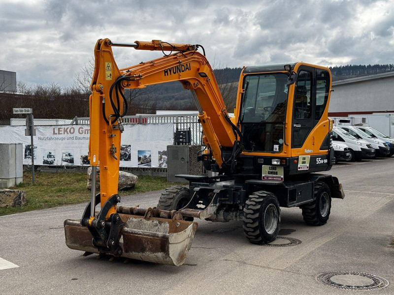 Hyundai Robex 55W-9A - Gumikerekes kotró: 5 kép. Hyundai Robex 55W-9A - Gumikerekes kotró: 5 kép.