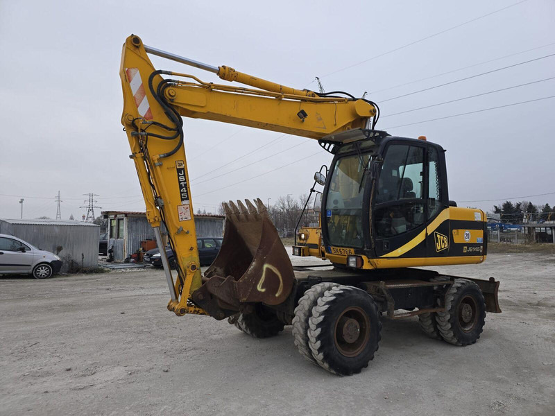 JCB JS 145W - Rubber wheel excavator - Gumikerekes kotró: 2 kép. JCB JS 145W - Rubber wheel excavator - Gumikerekes kotró: 2 kép.