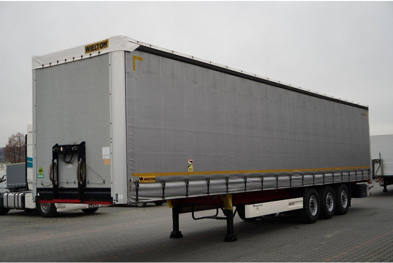 Wielton FIRANKA STANDARD / MULDA DO STALI - 9 M / OŚ PODNOSZONA / SAF / - Ponyvás félpótkocsi: 1 kép. Wielton FIRANKA STANDARD / MULDA DO STALI - 9 M / OŚ PODNOSZONA / SAF / - Ponyvás félpótkocsi: 1 kép.