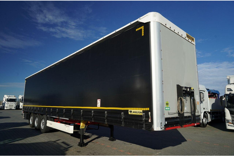 Wielton FIRANKA STANDARD / MULDA DO STALI - 9 M / OŚ PODNOSZONA / SAF / - Ponyvás félpótkocsi: 2 kép. Wielton FIRANKA STANDARD / MULDA DO STALI - 9 M / OŚ PODNOSZONA / SAF / - Ponyvás félpótkocsi: 2 kép.