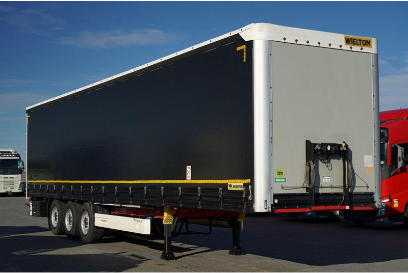 Wielton FIRANKA STANDARD / MULDA DO STALI - 9 M / OŚ PODNOSZONA / SAF / - Ponyvás félpótkocsi: 1 kép. Wielton FIRANKA STANDARD / MULDA DO STALI - 9 M / OŚ PODNOSZONA / SAF / - Ponyvás félpótkocsi: 1 kép.