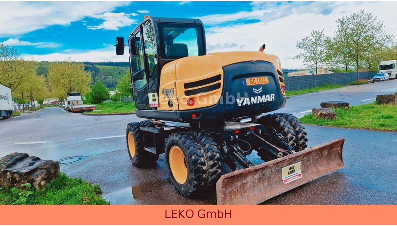Yanmar B 95W Mit Drei Löffeln und Ein Hammer - Gumikerekes kotró: 5 kép. Yanmar B 95W Mit Drei Löffeln und Ein Hammer - Gumikerekes kotró: 5 kép.